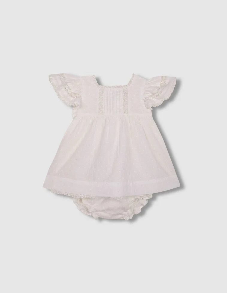 Vestido con jaretas y tiras bordadas