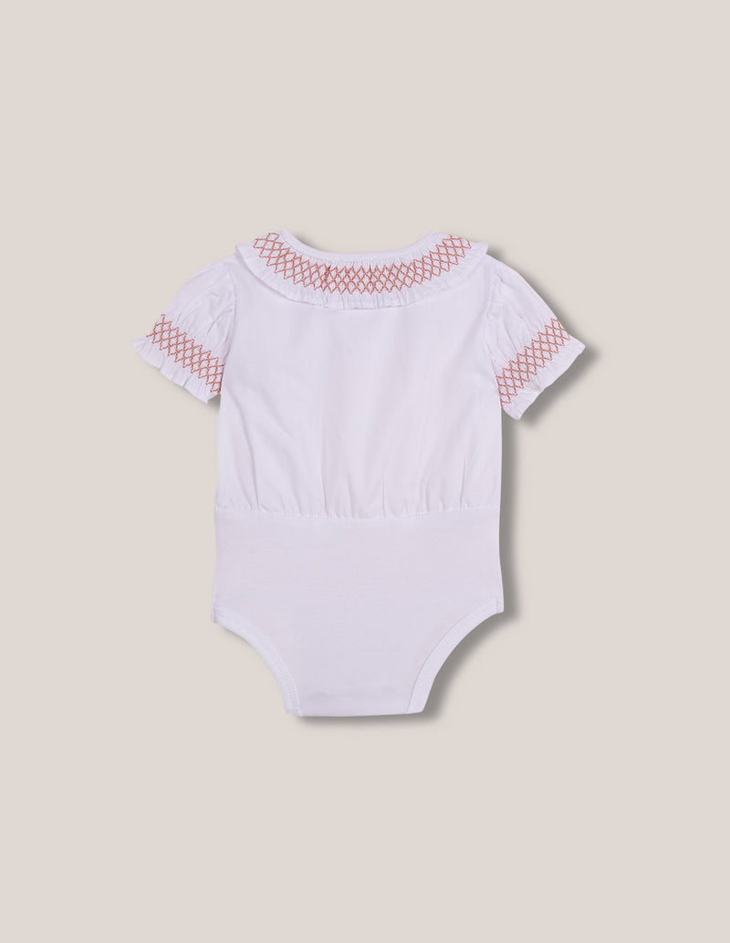 Body con bordado rojo para bebé